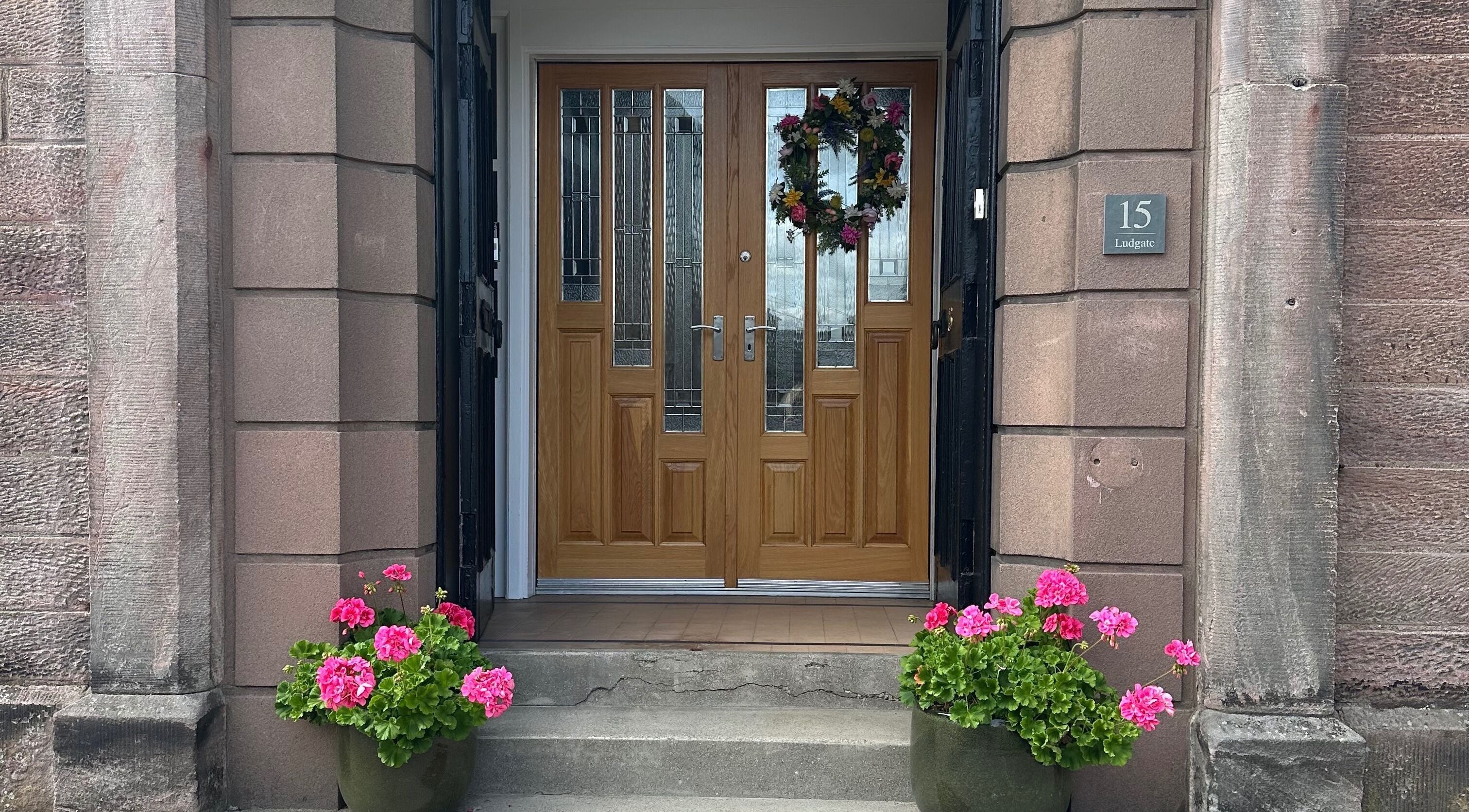 Welcoming front door of Fiona Dalziel Holistic Therapy in Alloa, Scotland, GB with floral decor.