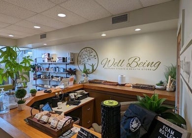 Interior of Well Being Akron with massage products and greenery, located in Akron, Ohio, US.