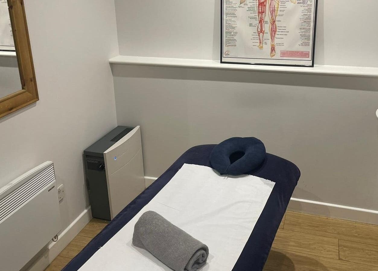 Therapy & Life Centre serene massage room in Coulsdon, England, GB with massage table and anatomy chart.