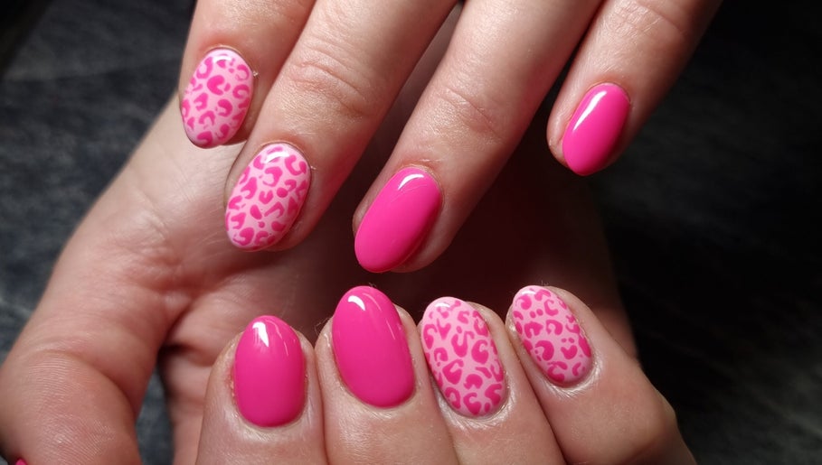 Stylish pink leopard print nails at In The Buff by Marizelle, Cape Town, Western Cape, ZA.
