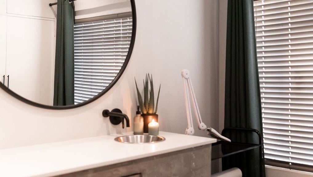 Chic treatment room at Duet Aesthetics Laser & Beauty, Lydenburg, Mpumalanga, ZA with mirror and candles.