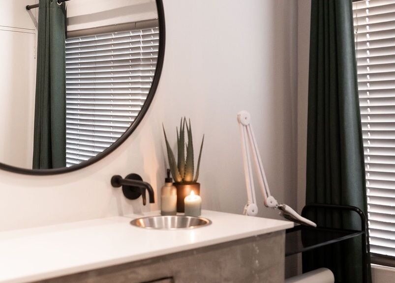 Chic treatment room at Duet Aesthetics Laser & Beauty, Lydenburg, Mpumalanga, ZA with mirror and candles.