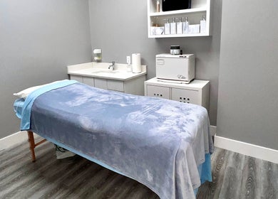 Tranquil treatment room at Diamond Beauty, Surrey, British Columbia, CA with soft blue bedding.