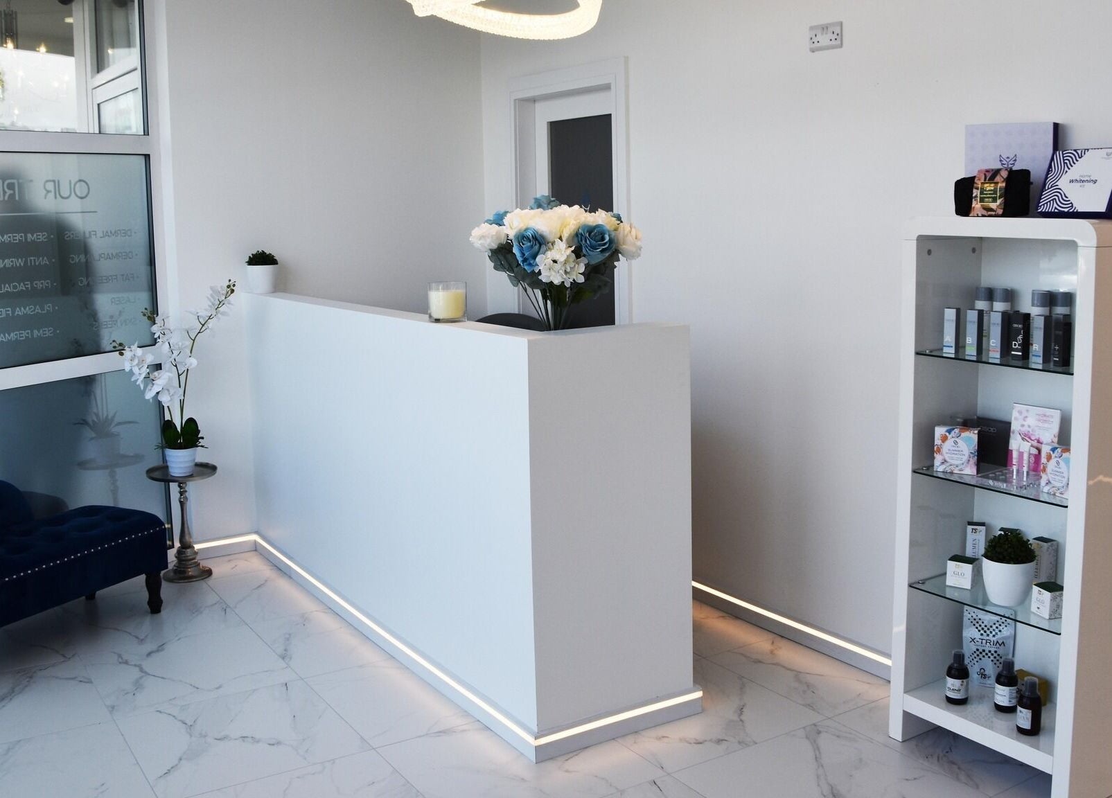 Elegant reception area at Ace Aesthetics, Ramelton, County Donegal, IE featuring plush seating and product display.