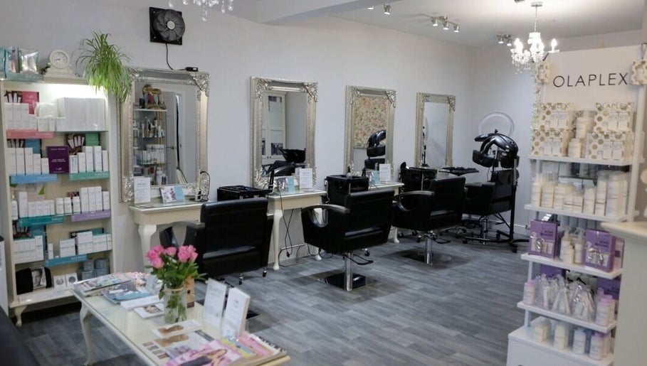 Chic interior of Erika’s Beauty in Derby, England, GB showcasing stylish mirrors and product displays.