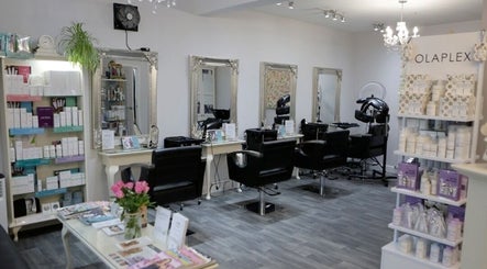 Chic interior of Erika’s Beauty in Derby, England, GB showcasing stylish mirrors and product displays.