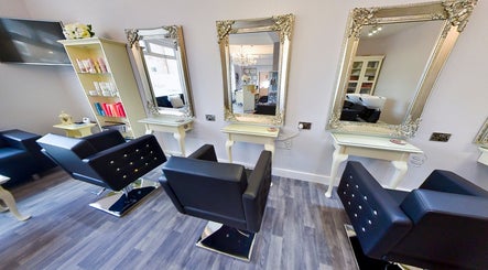 Elegant salon mirrors and chairs at Erika’s Beauty in Derby, England, GB, showcasing a stylish interior.