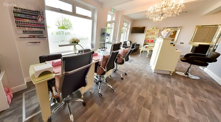 Bright, elegant interior of Erika’s Beauty nail salon in Derby, England, featuring stylish manicure stations.