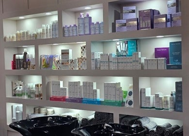 Shelf display of beauty products at Erika’s Beauty, Derby, England, GB. Variety of skincare and haircare items.
