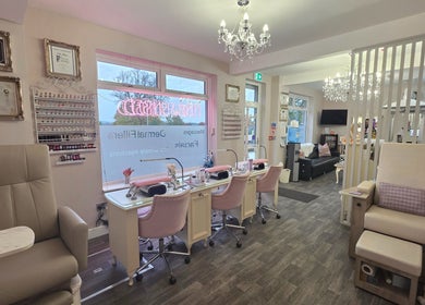 Spacious, elegant nail and beauty salon interior at Erika’s Beauty, Derby, England, GB, showcasing manicure stations.