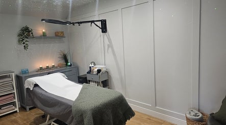 Relaxing treatment room at Erika’s Beauty, Derby, England, GB featuring a massage bed and calming decor.
