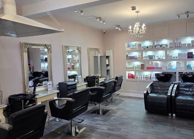 Chic interior of Erika’s Beauty in Derby, England, GB showcasing workstations and product shelves.