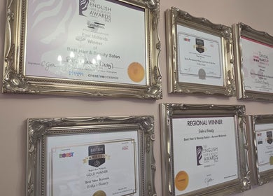 Award certificates at Erika’s Beauty, Derby, England, showcasing excellence in beauty and wellness services.