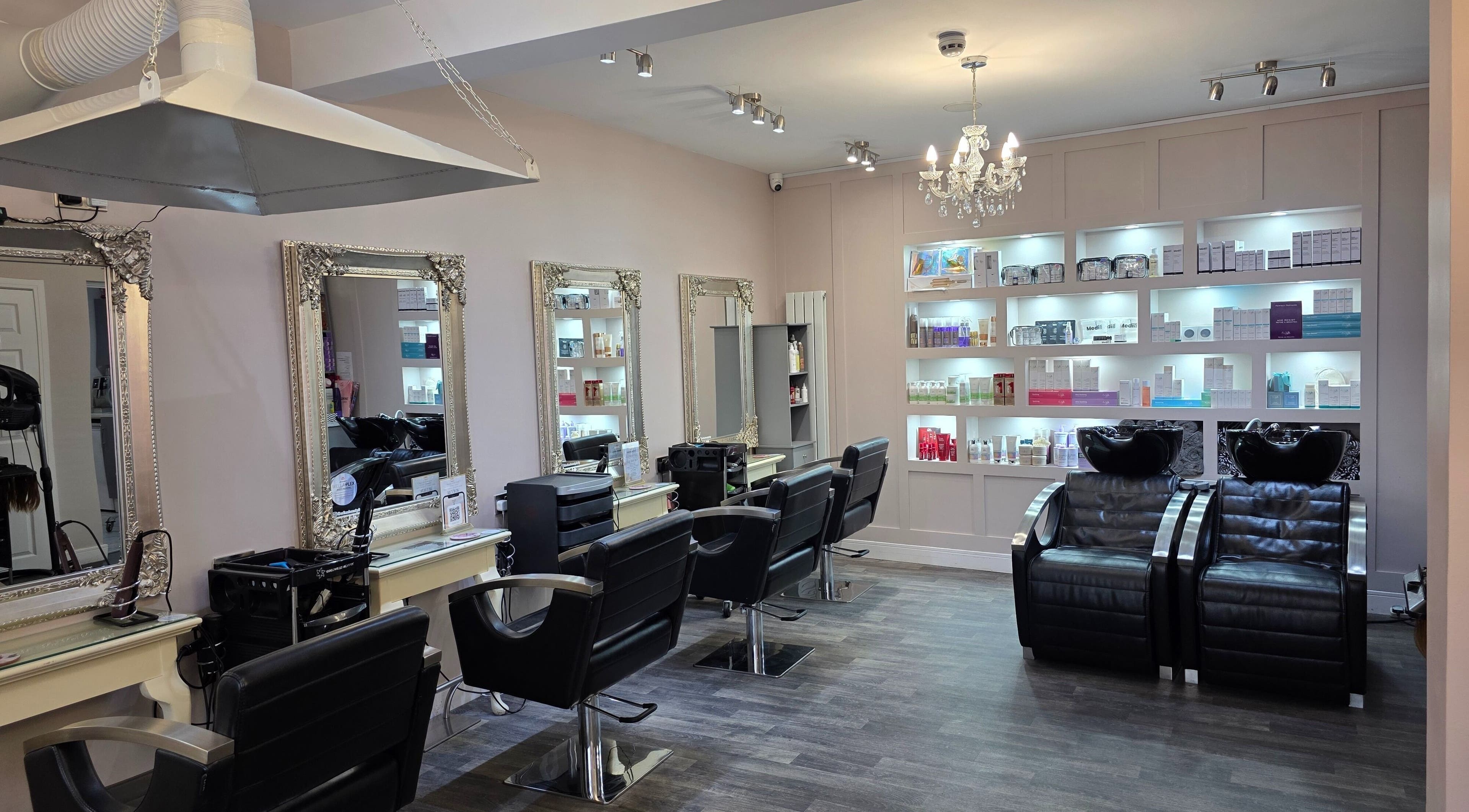 Elegant interior of Erika’s Beauty salon in Derby, England, GB with stylish chairs and mirrored walls.