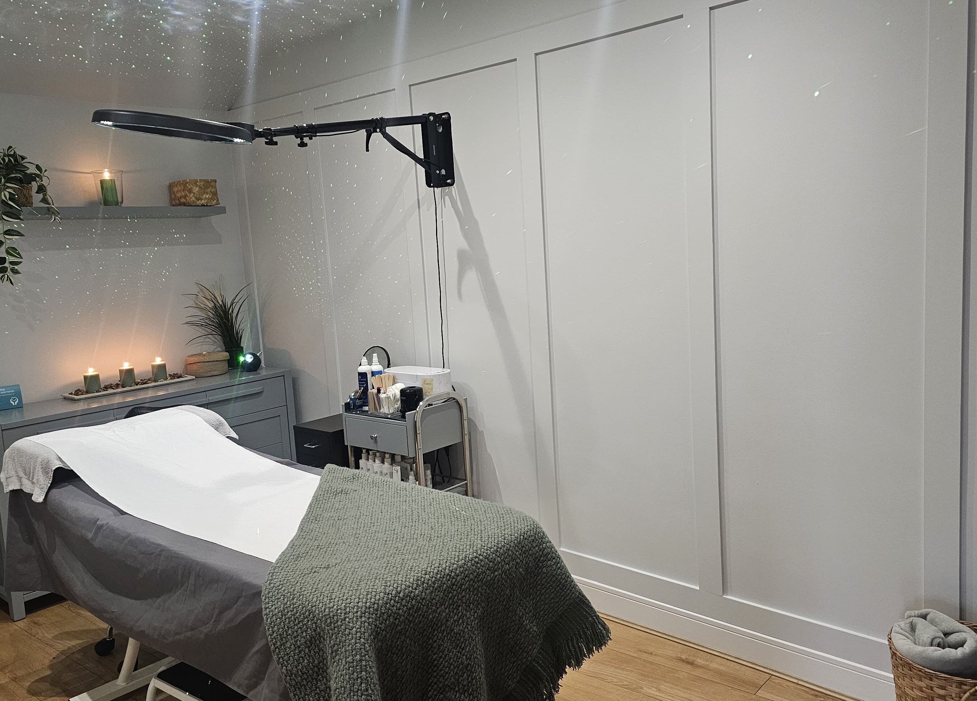 Tranquil treatment room at Erika’s Beauty, Derby, England, GB with ambient lighting and cozy setup.