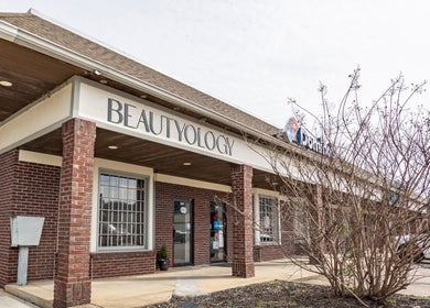 Beautyology salon exterior in Ooltewah, Tennessee, US featuring brick pillars and a welcoming entrance.