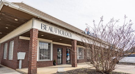 Beautyology salon exterior in Ooltewah, Tennessee, US featuring brick pillars and a welcoming entrance.