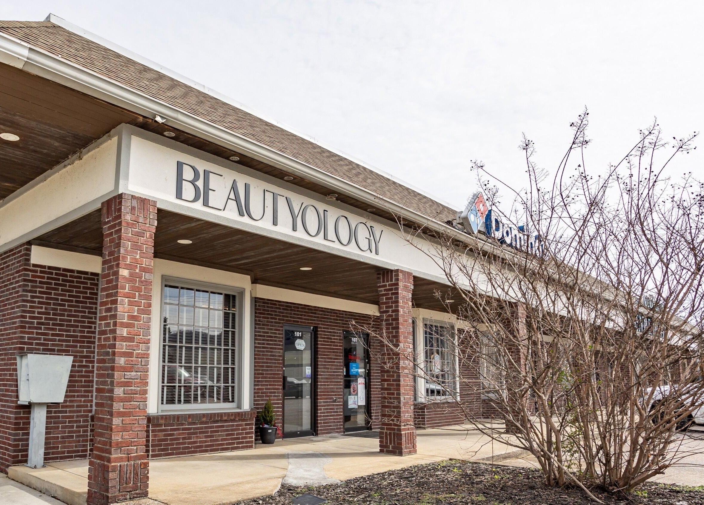 Exterior of BEAUTYOLOGY venue in Ooltewah, Tennessee, US showcasing a stylish brick facade.