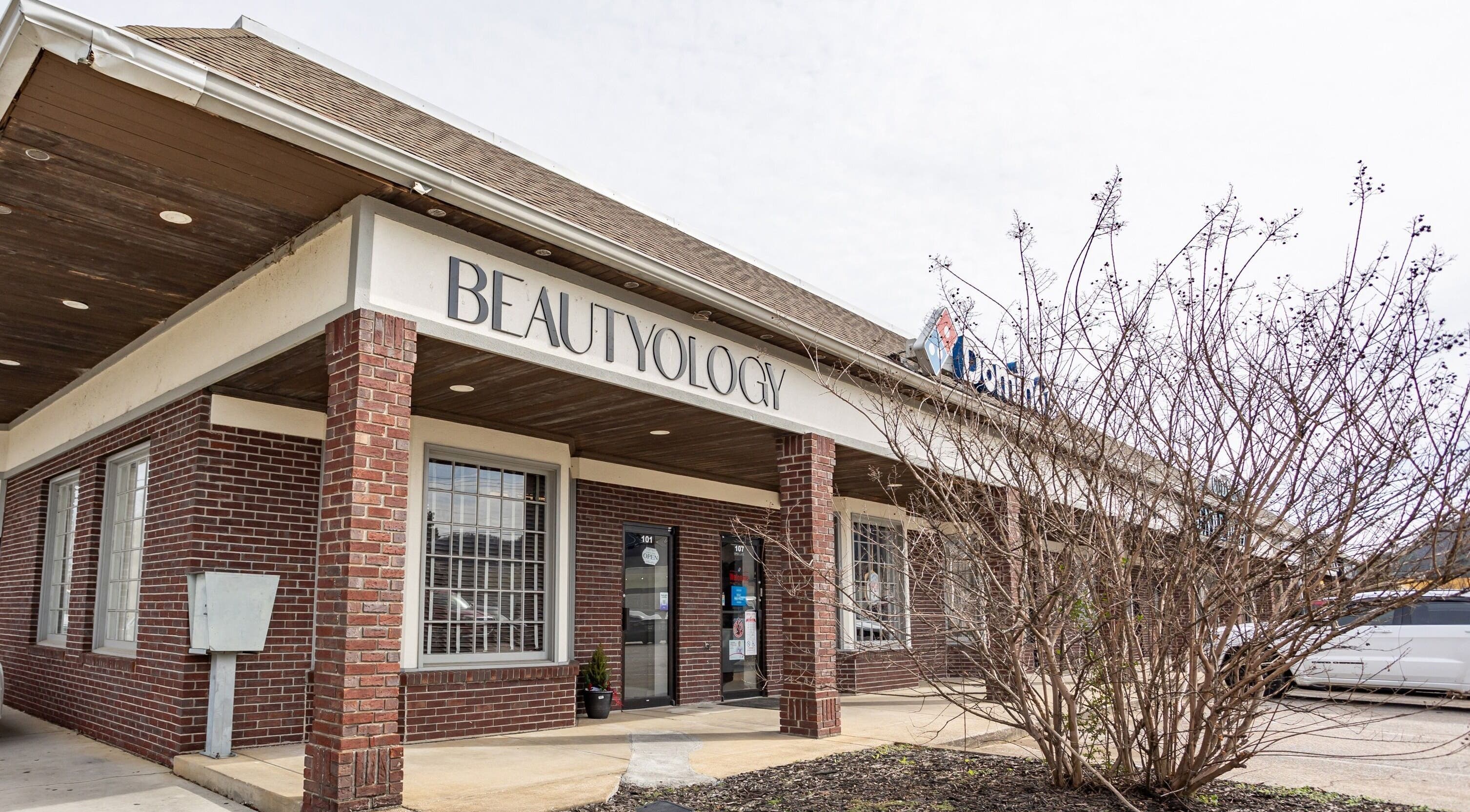 Exterior of BEAUTYOLOGY venue in Ooltewah, Tennessee, US showcasing a stylish brick facade.