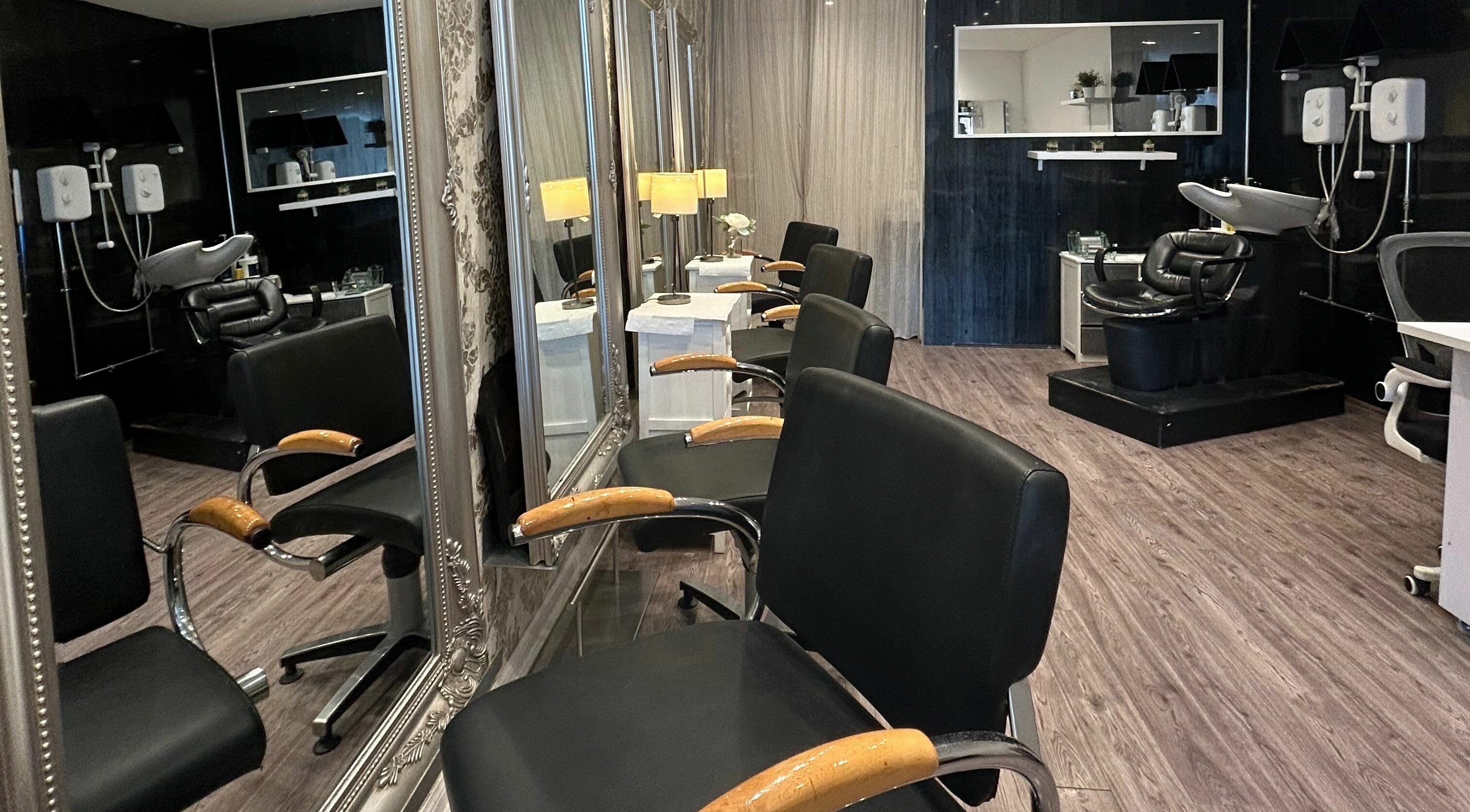 Chic salon interior at G:23, Glasgow, Scotland, GB with styling chairs, mirrors, and modern wash stations.