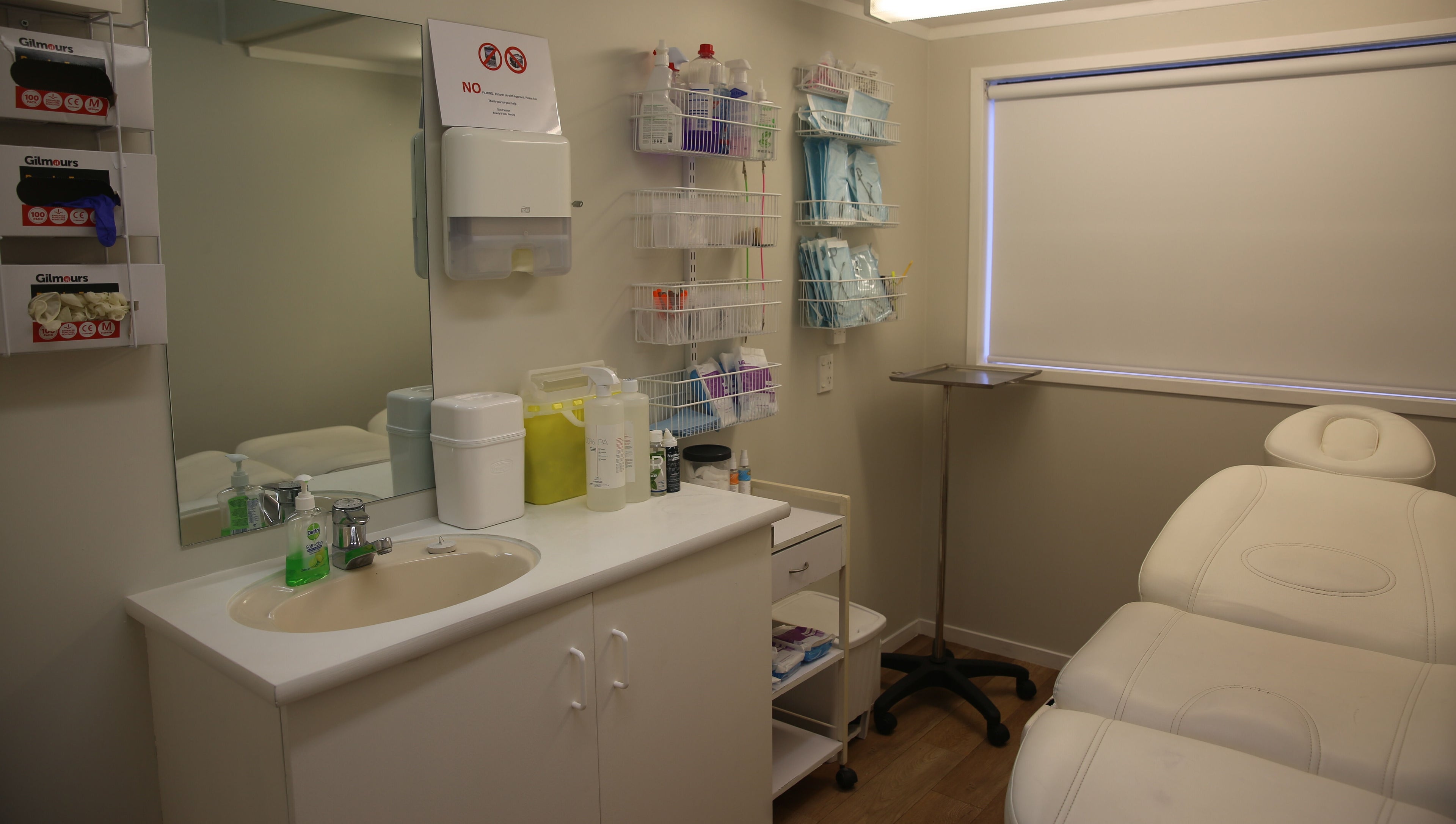 Elegant treatment room at Skin Passion, Red Beach, Auckland, NZ with a comfortable white therapy bed and clean facilities.
