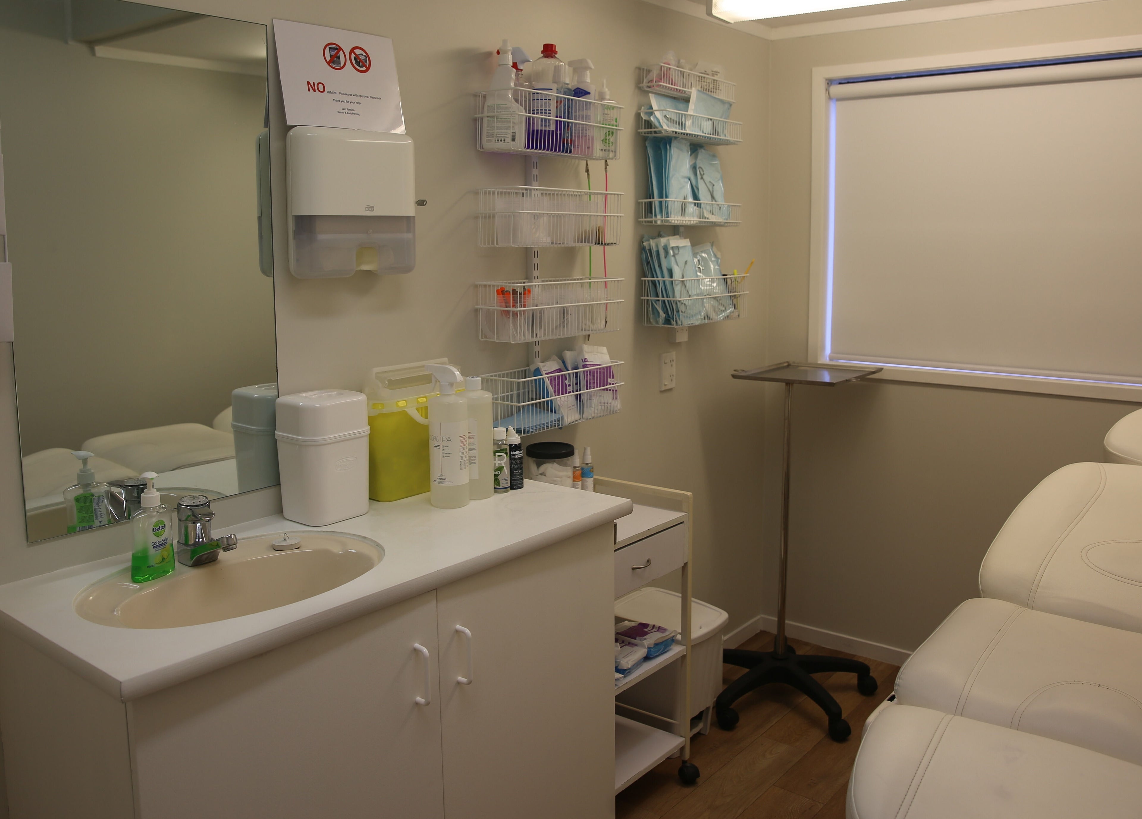 Elegant treatment room at Skin Passion, Red Beach, Auckland, NZ with a comfortable white therapy bed and clean facilities.