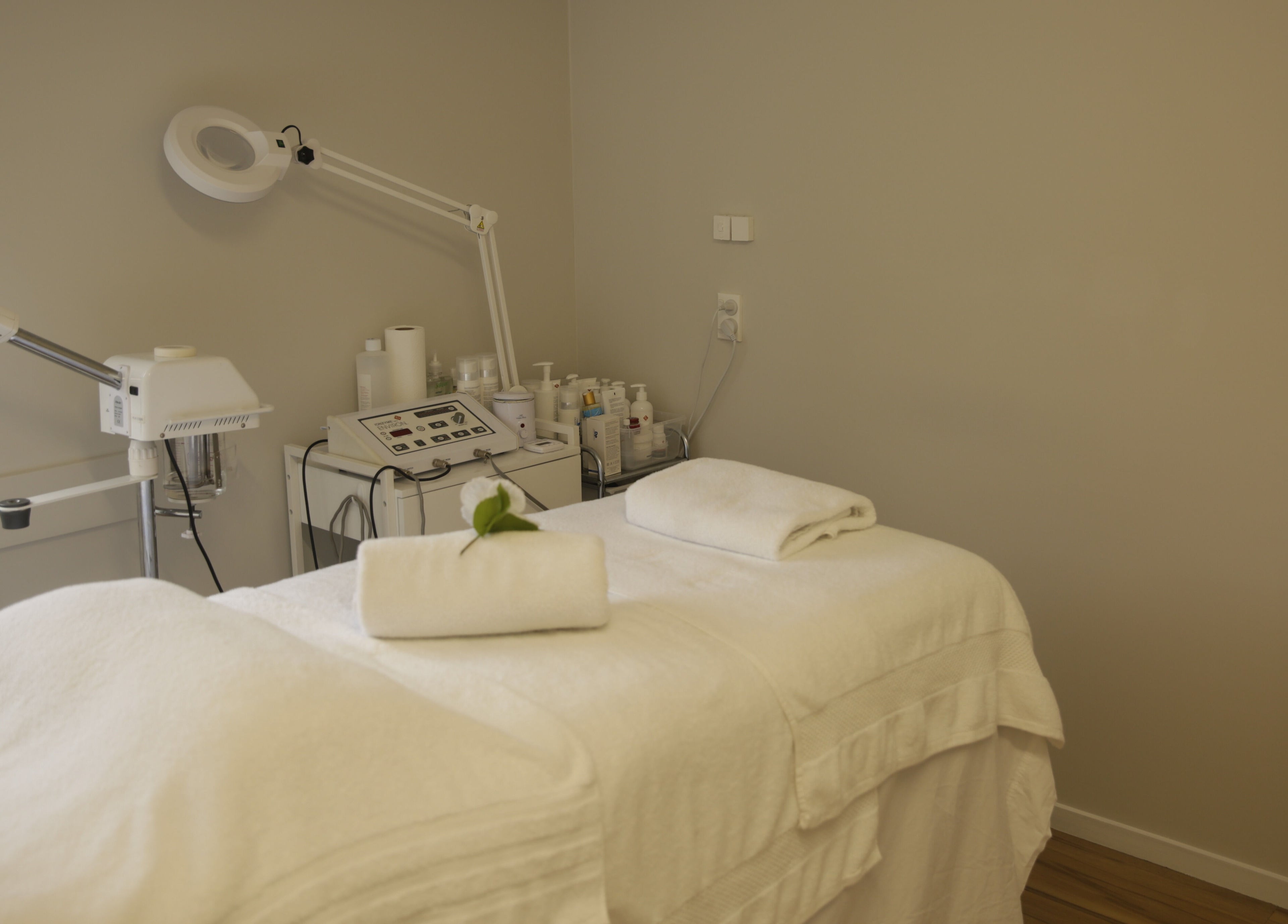 Tranquil treatment room at Skin Passion, Red Beach, Auckland, NZ featuring a massage table with fresh towels.