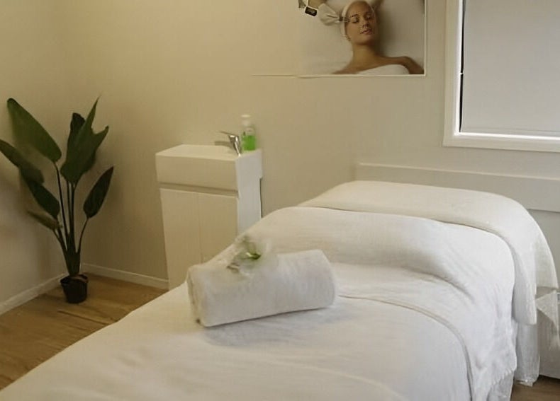 Tranquil treatment room at Skin Passion, Red Beach, Auckland, NZ featuring a neatly prepared massage table.