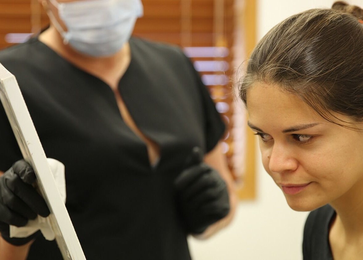 Client consulting with beauty expert at Skin Passion, Red Beach, Auckland, NZ for personalized skincare advice.