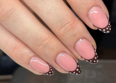 Stylish polka dot nail art at Charlotte Amelia Beauty, Penryn, England, GB.