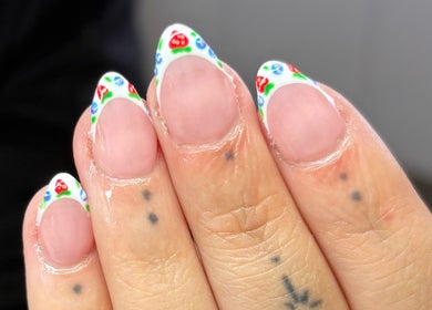 Elegant nail art with floral design at Charlotte Amelia Beauty, Penryn, England, GB. Perfect for a chic style.