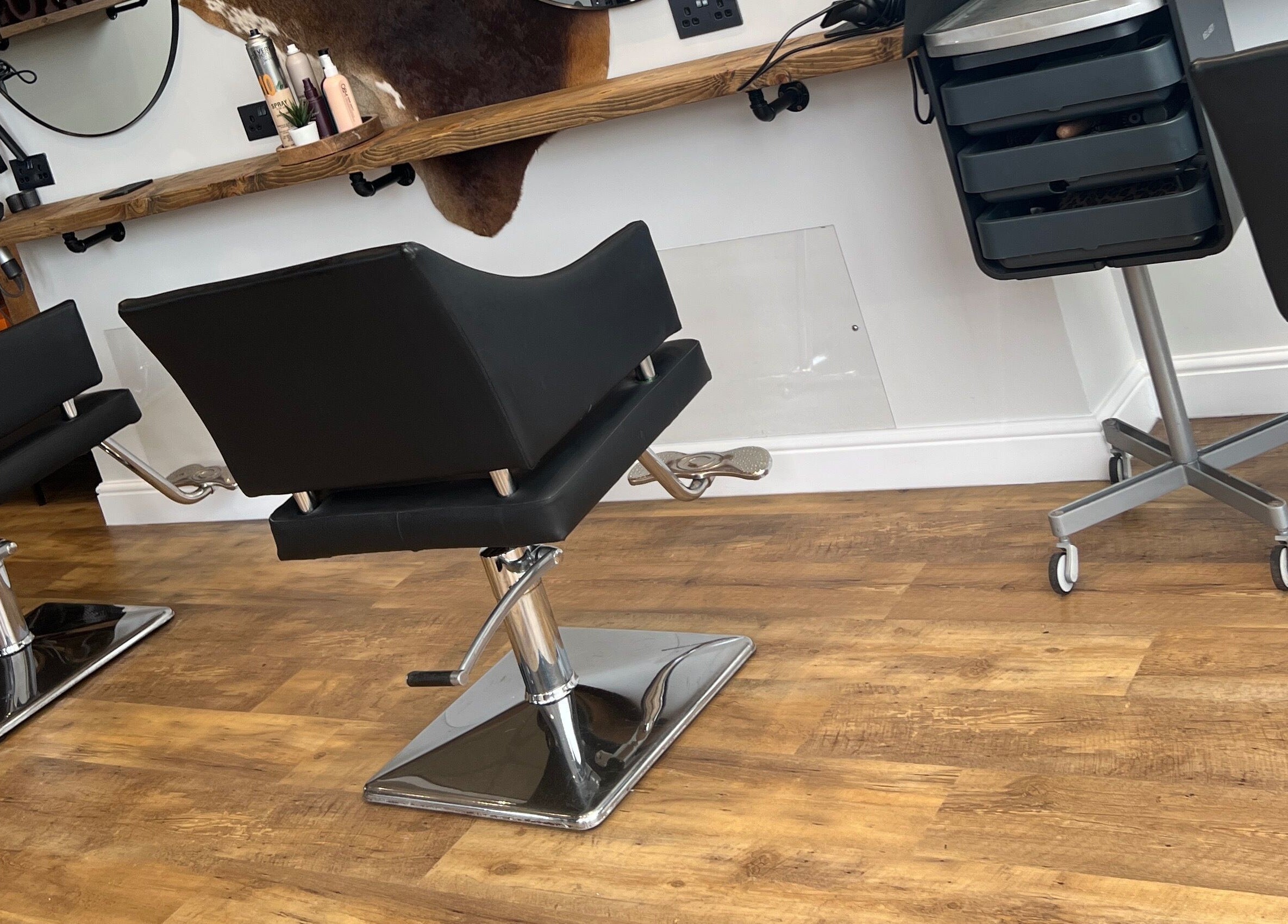 Modern salon chairs at Kaos, featuring sleek design in Keighley, England, GB.
