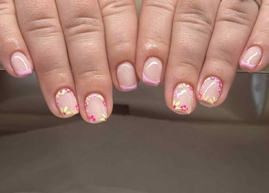 Floral nail art at HUTT Beauty, Ballycastle, Northern Ireland, GB, showcasing detailed pink designs.