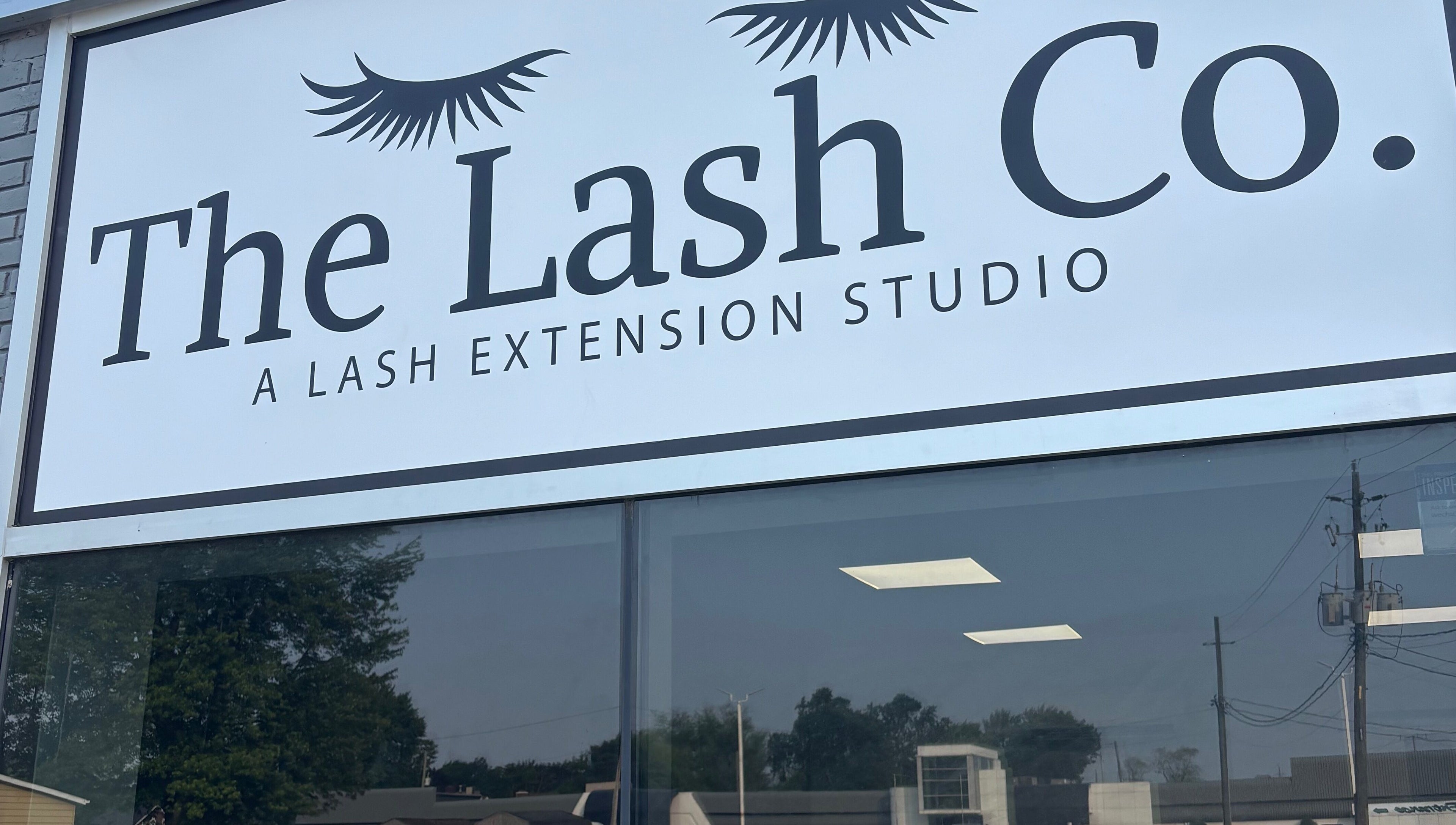 The Lash Co. storefront sign in Windsor, Ontario, CA, showcasing their lash extension studio.