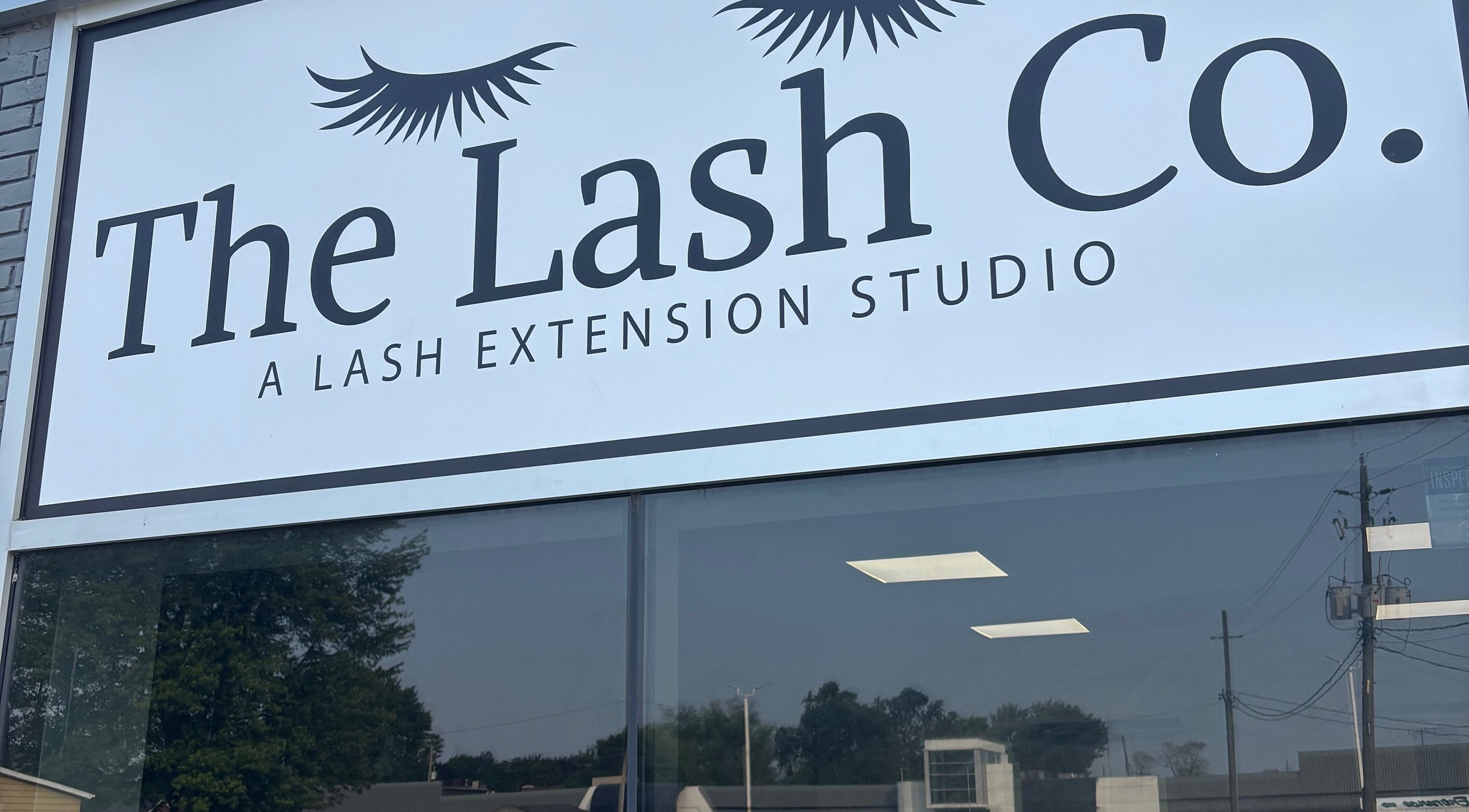 The Lash Co. storefront sign in Windsor, Ontario, CA, showcasing their lash extension studio.