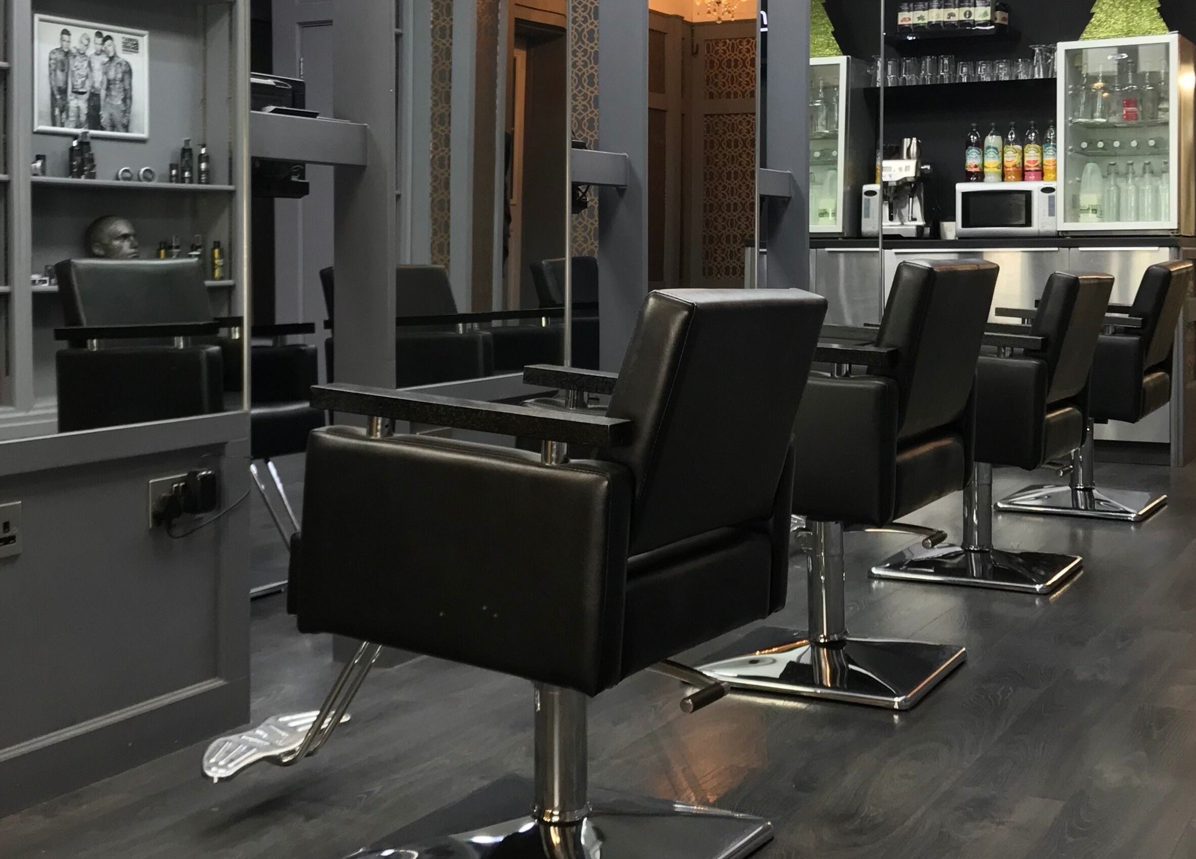 Modern salon chairs and mirrors at Davenports, Carmichael Chatham, Chatham, England, GB