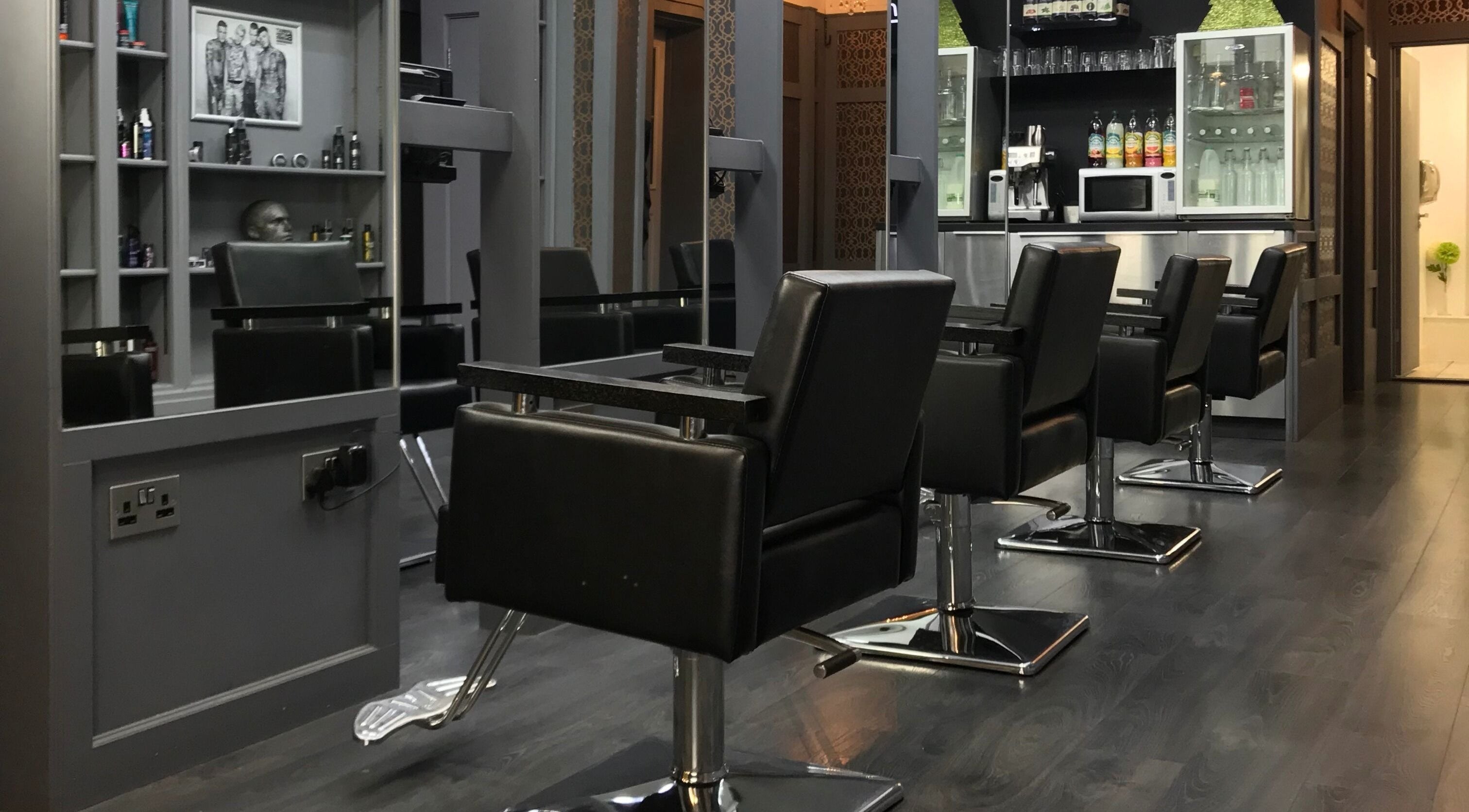 Modern salon chairs and mirrors at Davenports, Carmichael Chatham, Chatham, England, GB