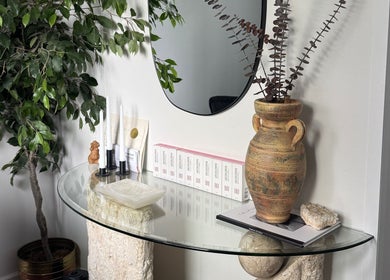 Elegant glass table with decor in Lashes by Alicia, Kamloops, British Columbia, CA.