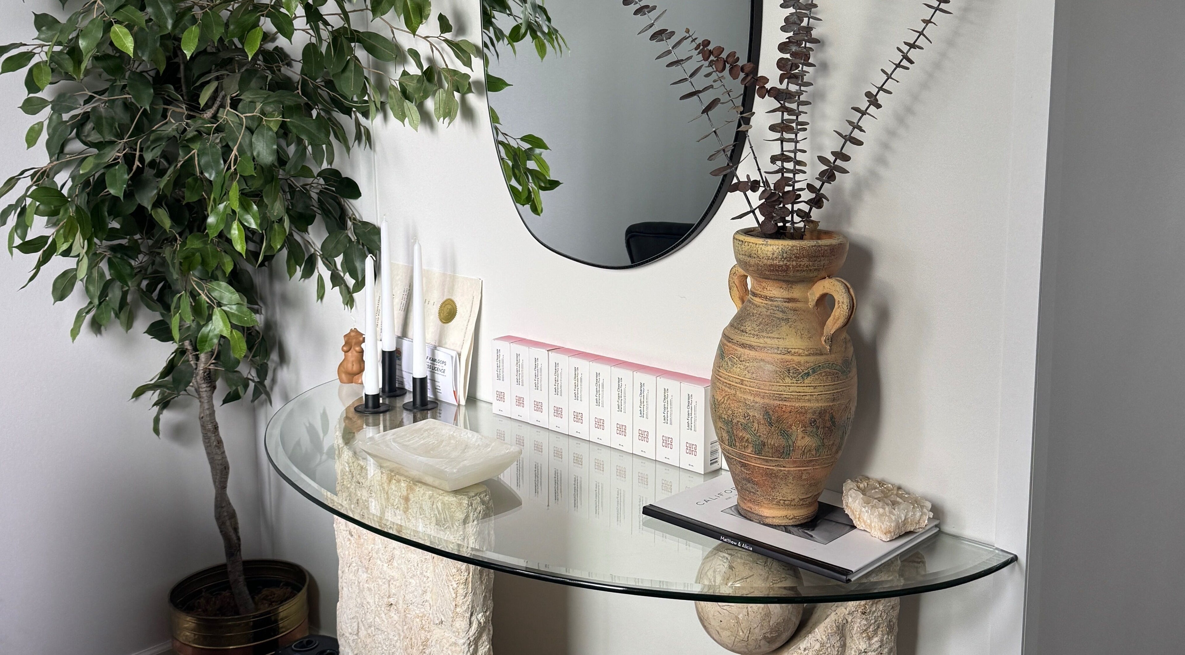 Elegant glass table with decor in Lashes by Alicia, Kamloops, British Columbia, CA.