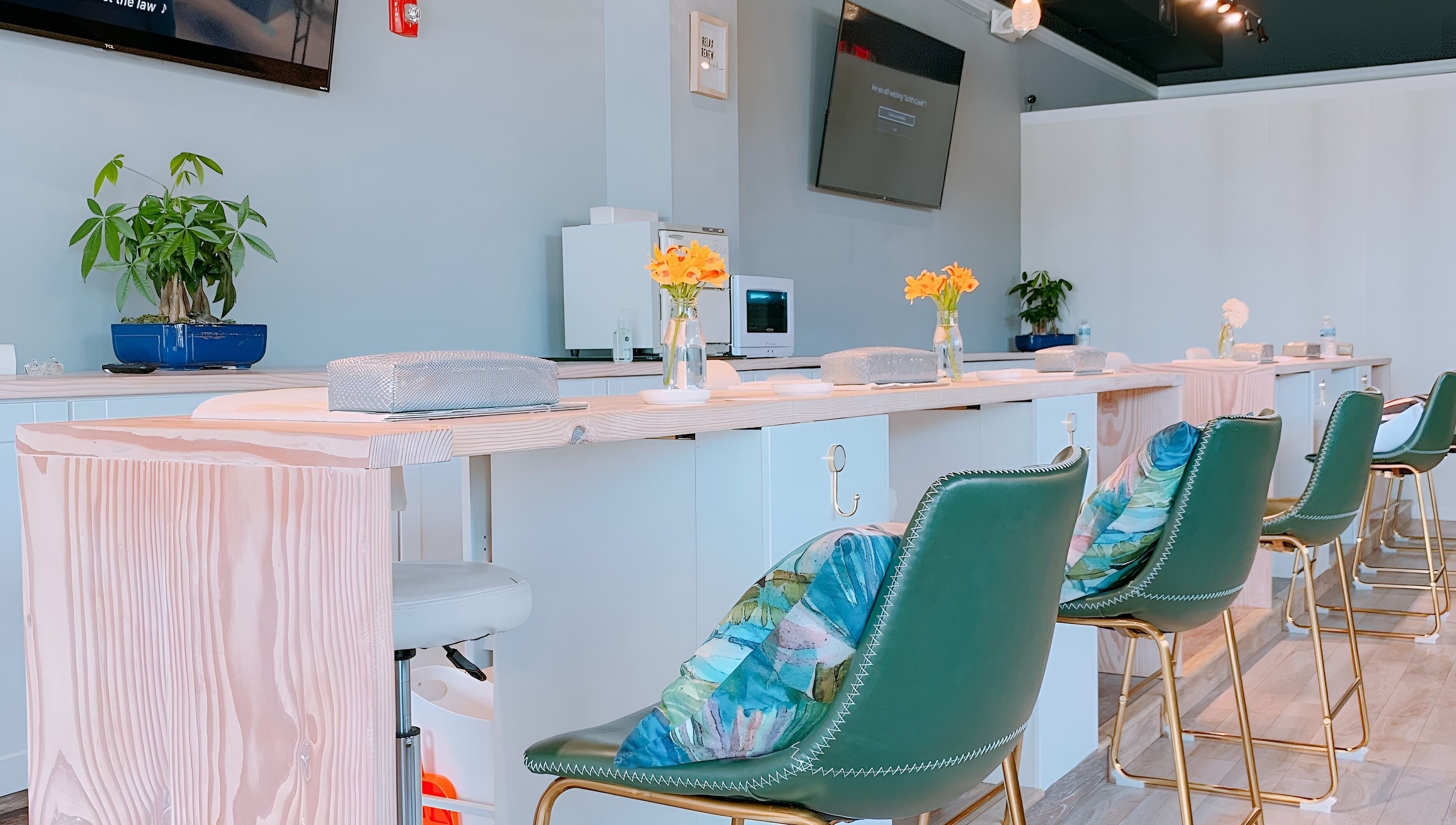 Elegant manicure station at NailBar Studio, Naperville, IL, US with stylish decor and comfortable seating.