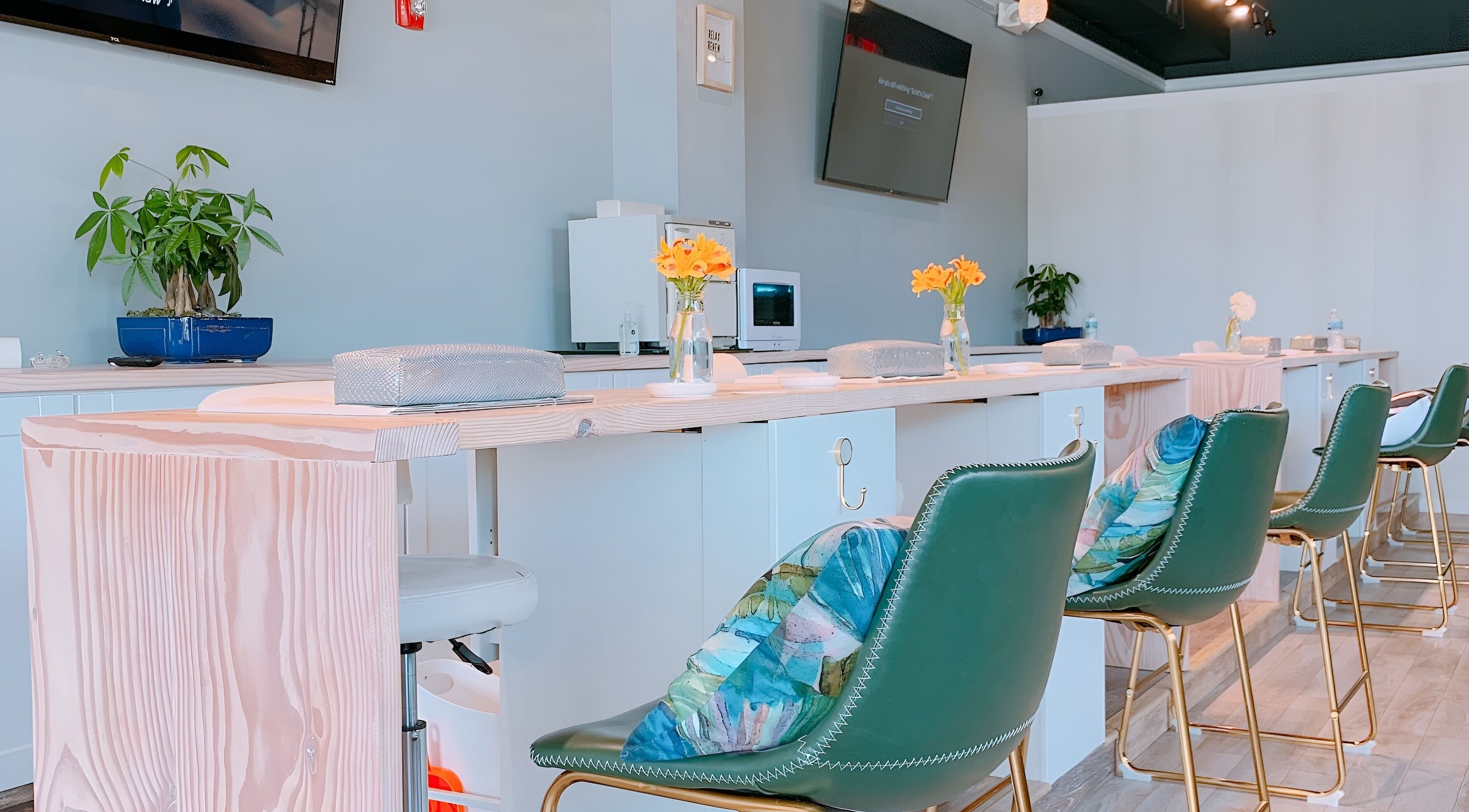 Elegant manicure station at NailBar Studio, Naperville, IL, US with stylish decor and comfortable seating.