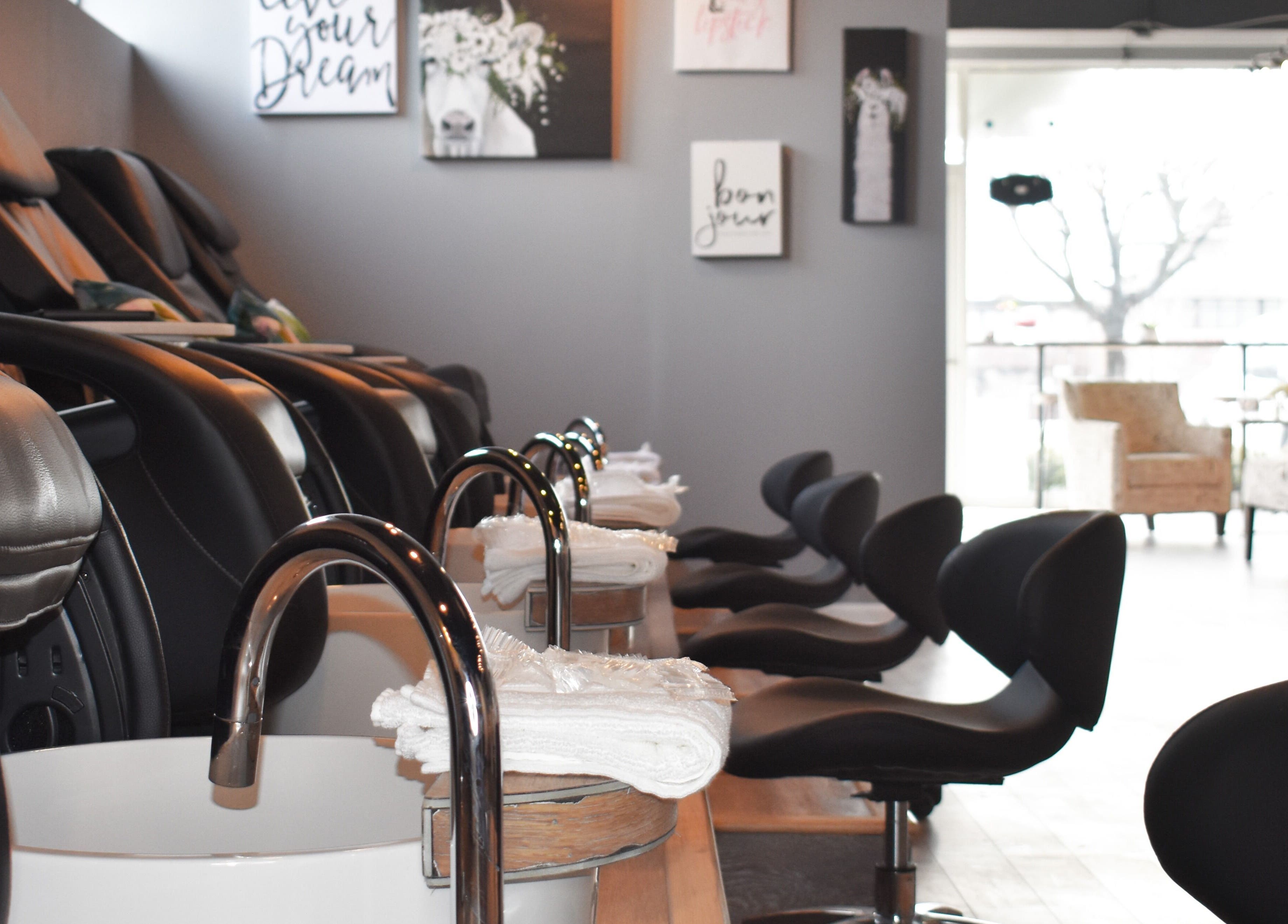 Upscale pedicure stations at NailBar Studio in Naperville, IL, US, showcasing modern elegance and comfort.
