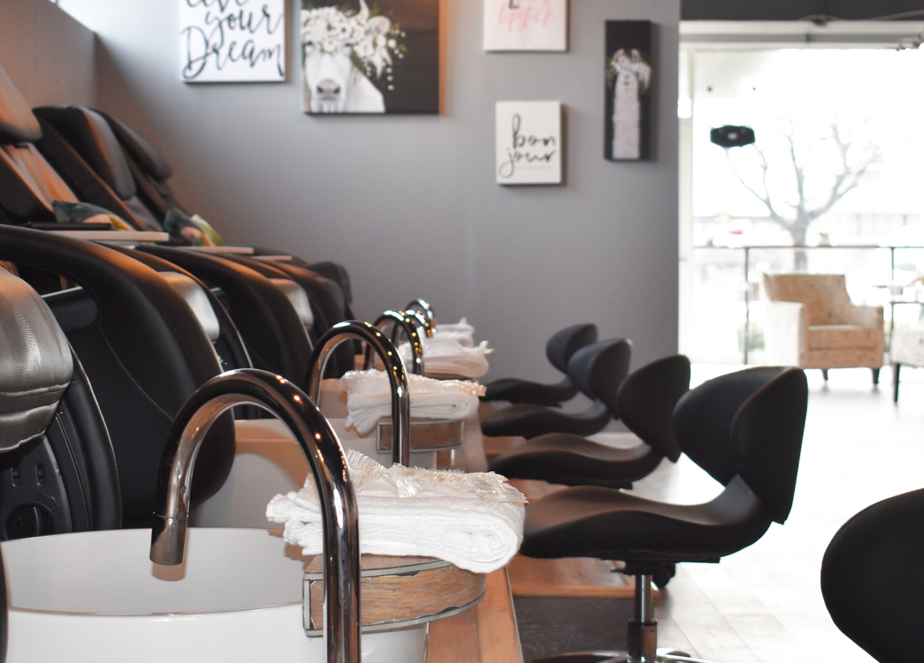 Upscale pedicure stations at NailBar Studio in Naperville, IL, US, showcasing modern elegance and comfort.