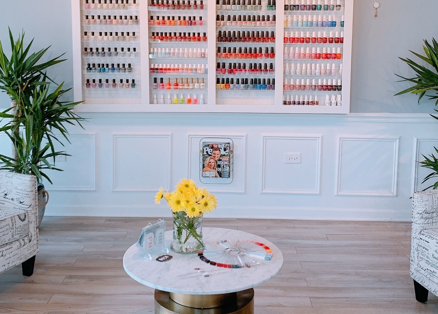 Elegant nail polish display and cozy seating at NailBar Studio, Naperville, IL, US.