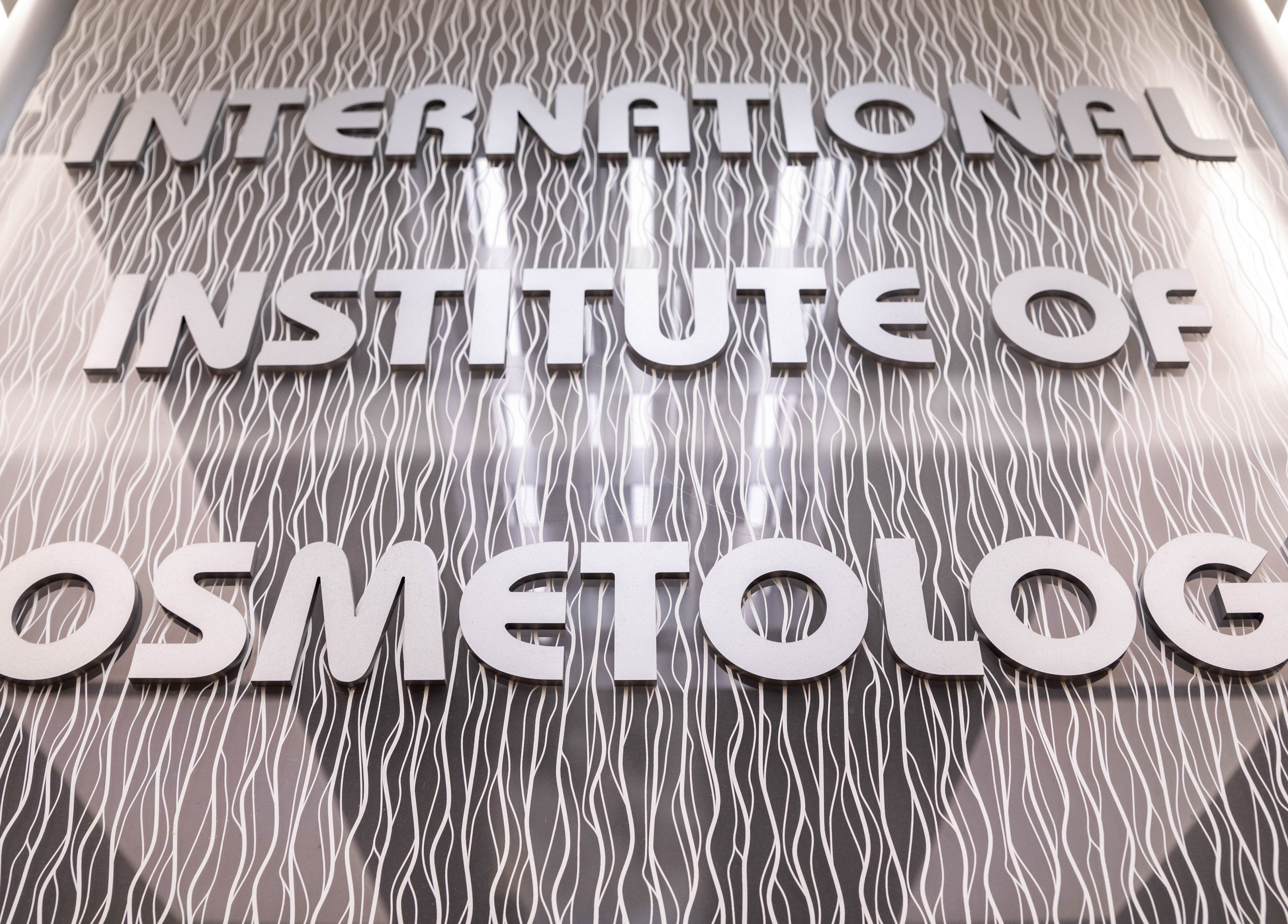Stylish sign of IIC Wethersfield at Wethersfield, Connecticut, US showcasing modern cosmetology training.
