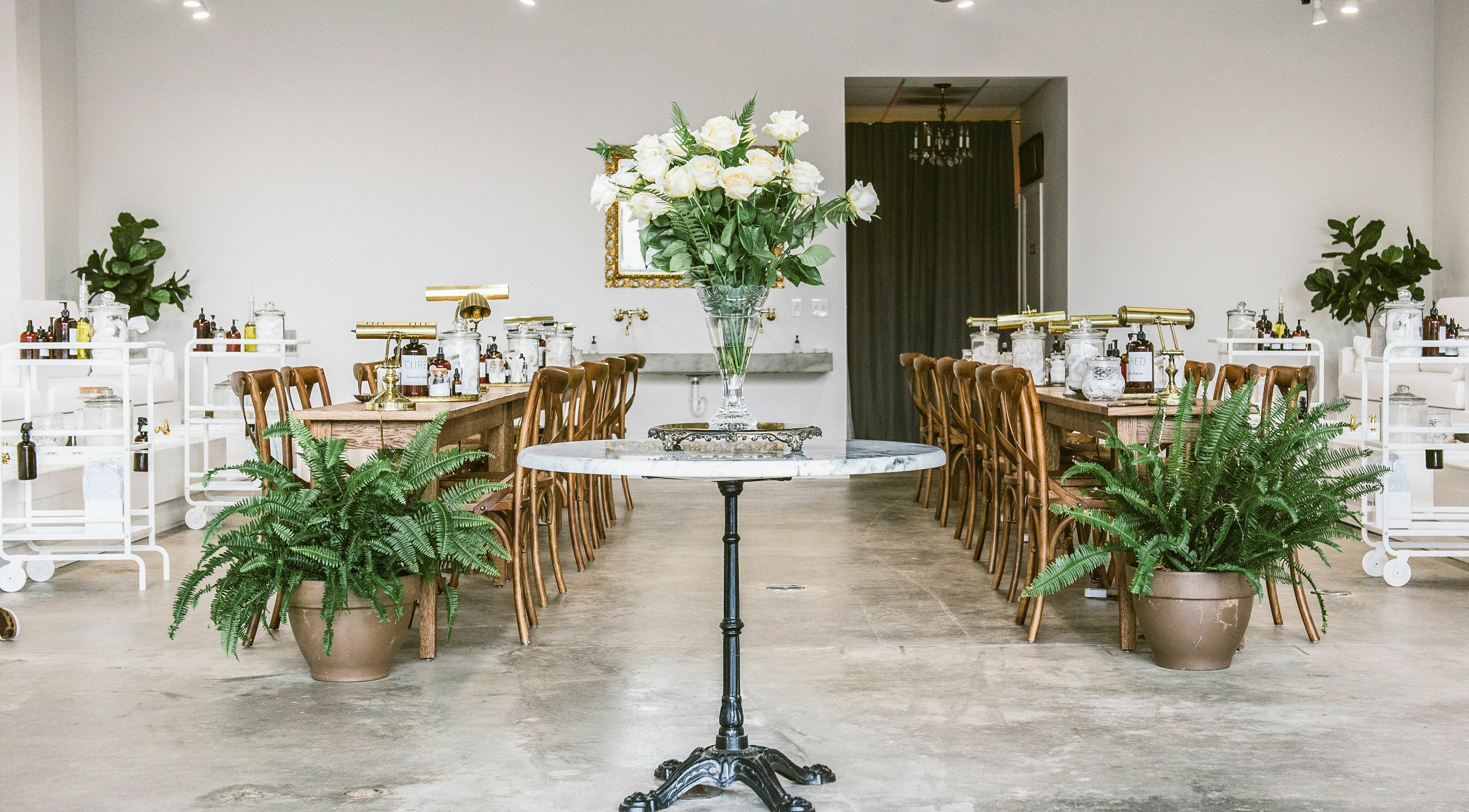 Elegant interior of Cured Nails in Nashville, Tennessee, US with chic decor and fresh greenery.