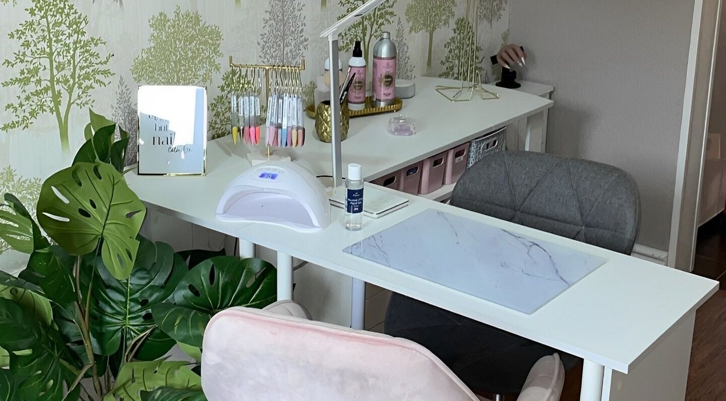 Elegant nail station at Nails By Leanne, Leyland, England, GB, with lush greenery and stylish decor.