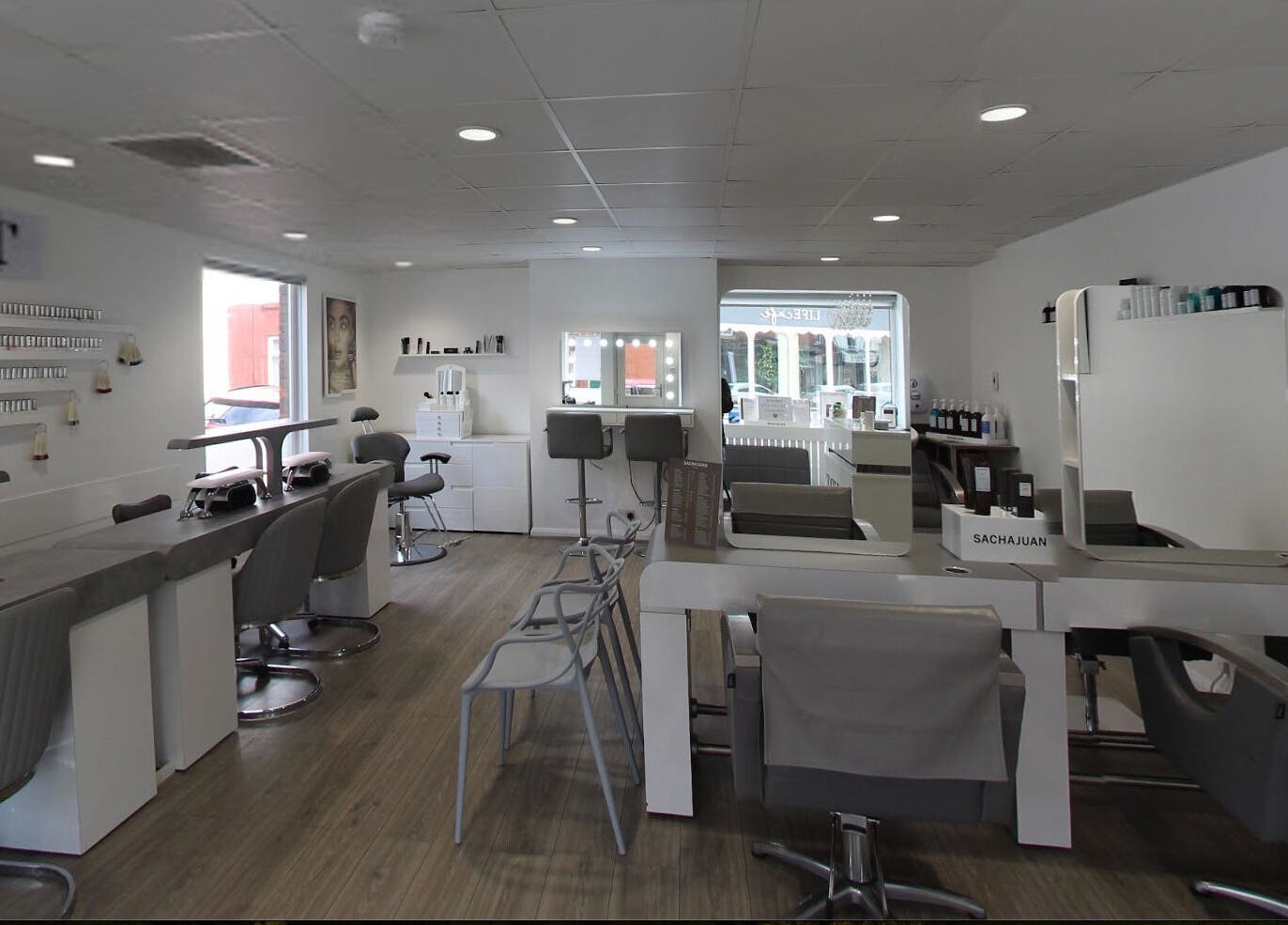 Modern interior of Prept Romiley salon, Romiley, England, GB, featuring stylish workstations and a welcoming ambiance.