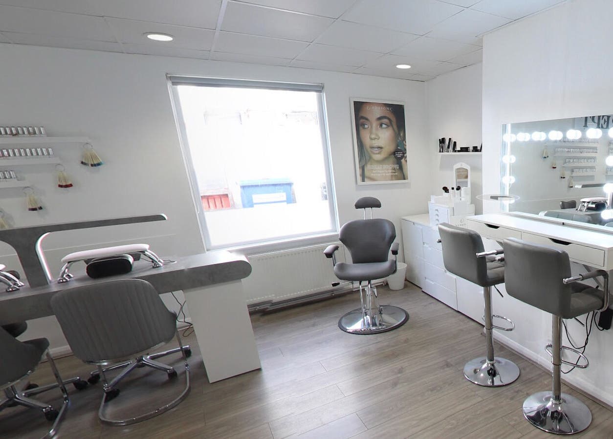 Sleek interior of Prept Romiley in Romiley, England, GB with makeup stations and modern chairs.