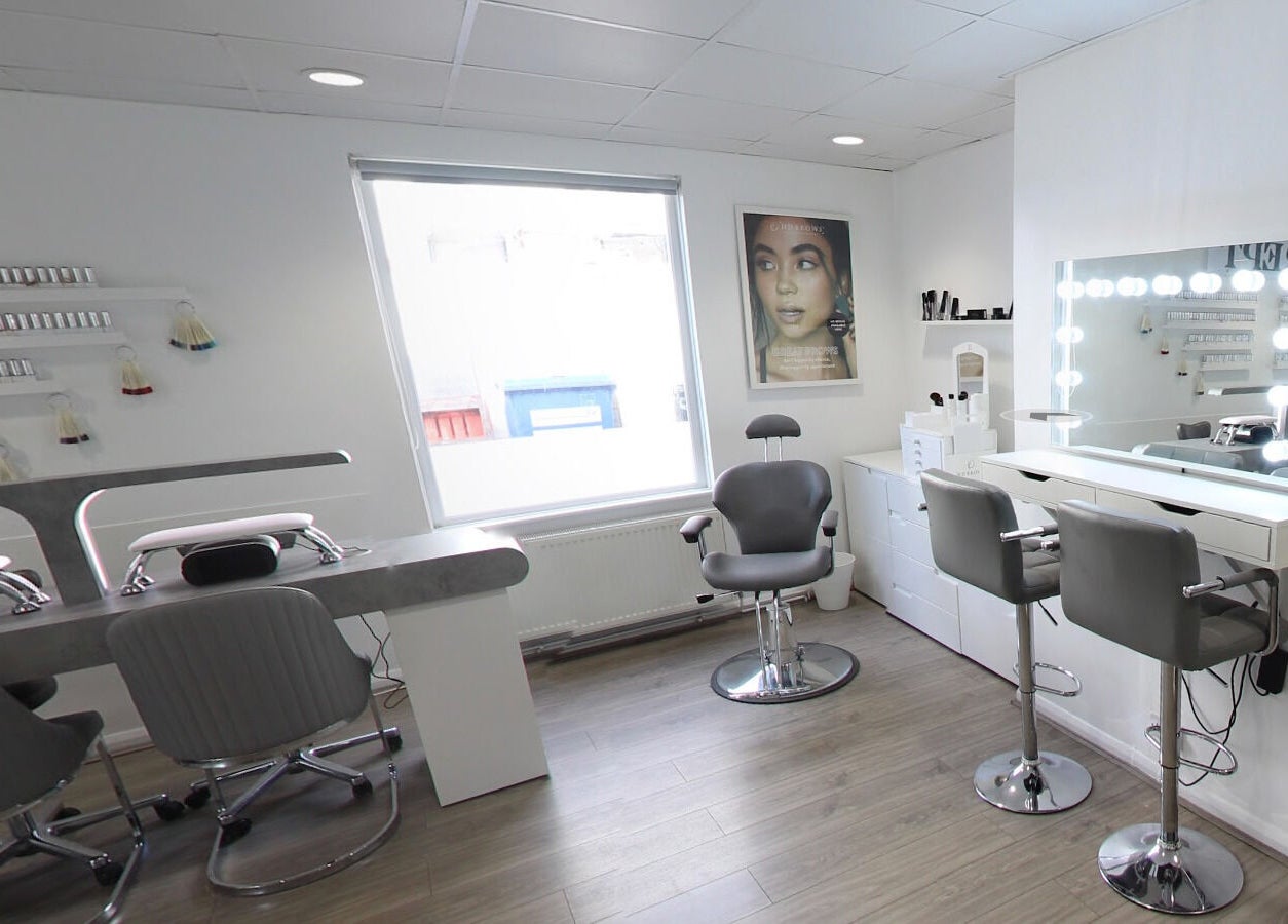 Sleek interior of Prept Romiley in Romiley, England, GB with makeup stations and modern chairs.